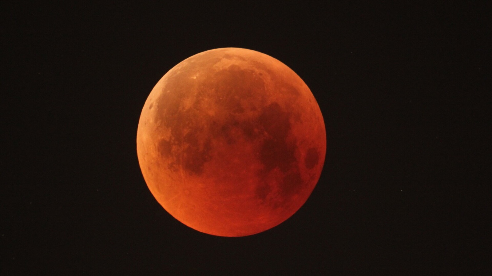 Sequence of a lunar eclipse arcing over stone pillars near Bryce Canyon