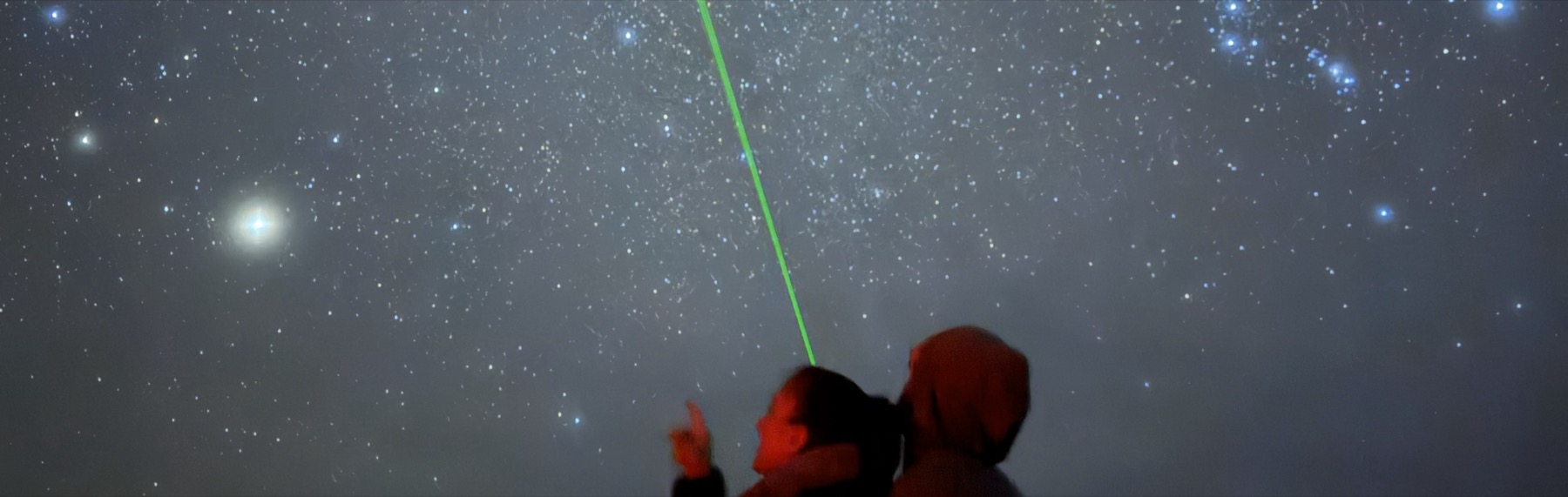 Visitors watching the night sky at Bryce Canyon, telescopes lit by red lights
